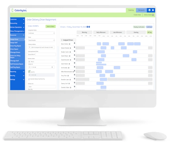 A desktop computer displaying the Caterbytes Order Delivery Driver Assignment interface, which features a detailed scheduling timeline for various drivers alongside a form for assigning a specific driver to an order.